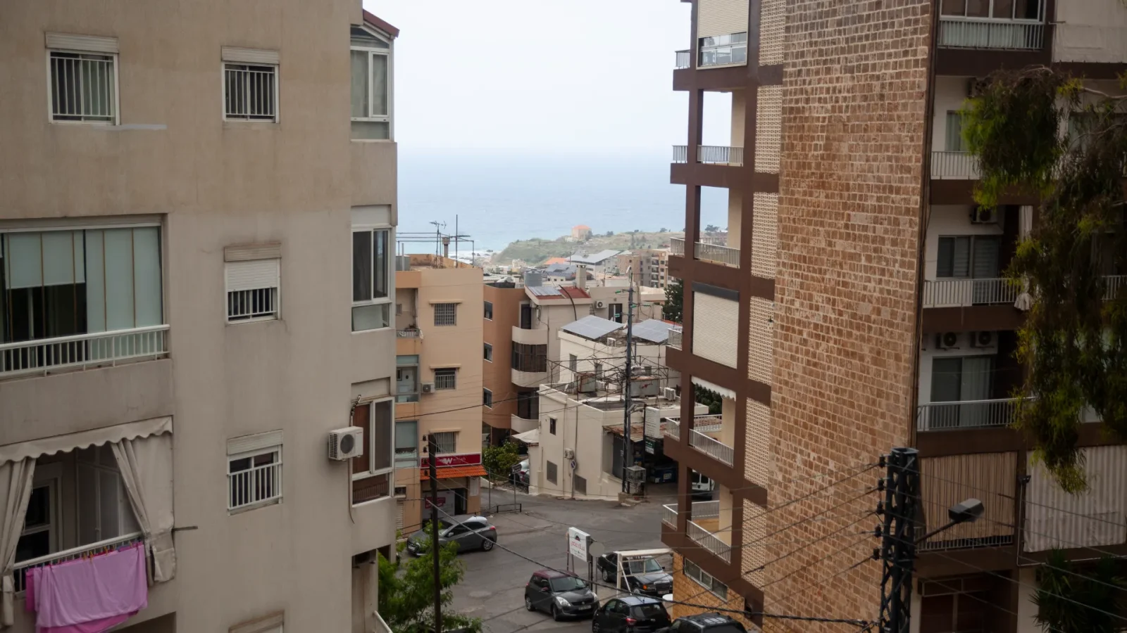 The view of the sea on a cloudy day from Chadi's rented apartment [Tessa Fox/Al Jazeera]